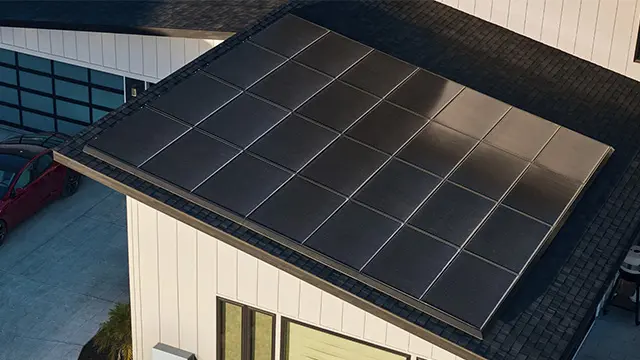 Tesla Powerwall battery installed on a patio wall